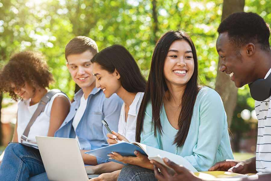 Group of young Multi-cultural Canadians sitting outside